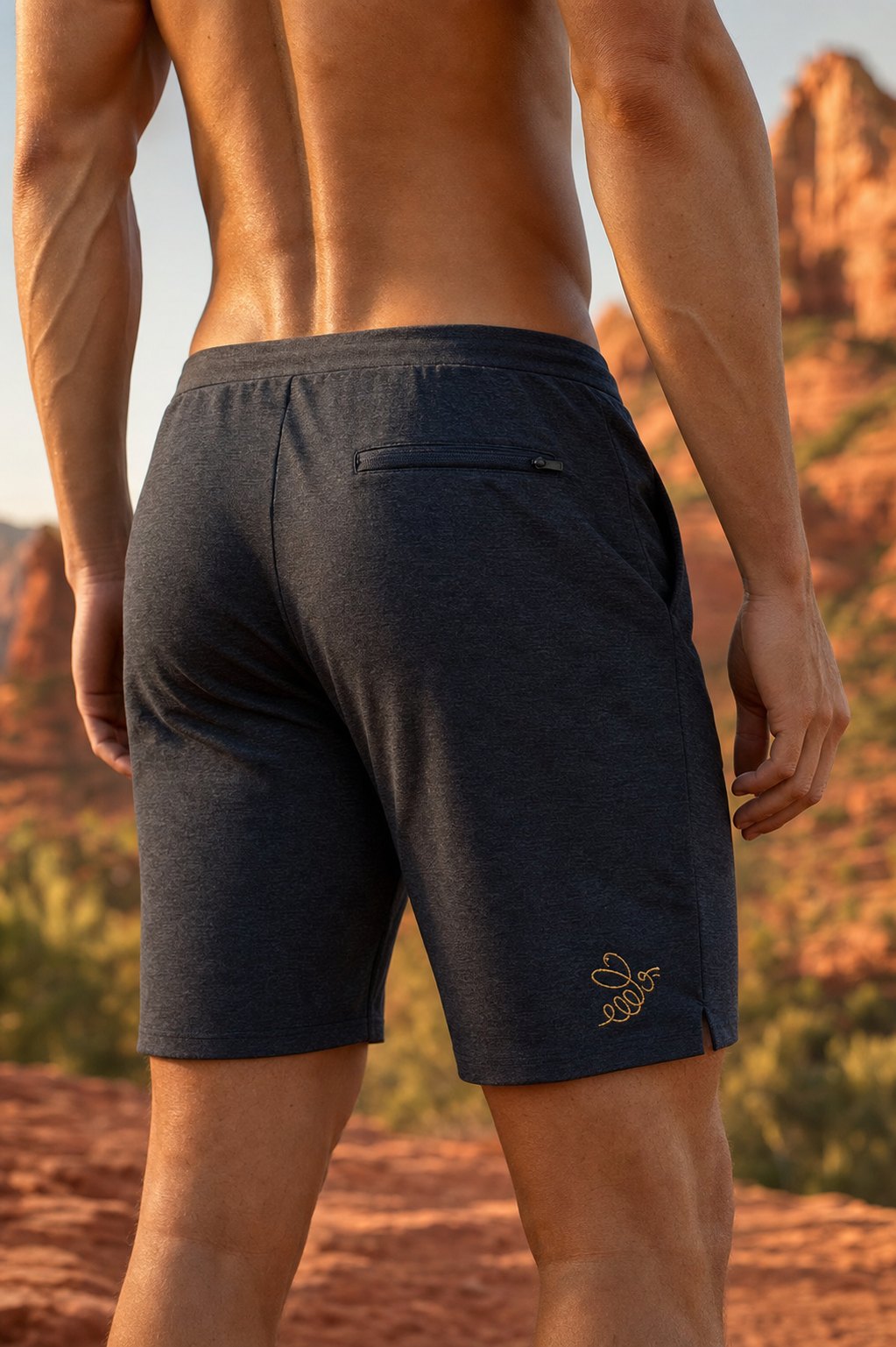 The Short on figure, back three-quarter view, Sedona red rock backdrop.